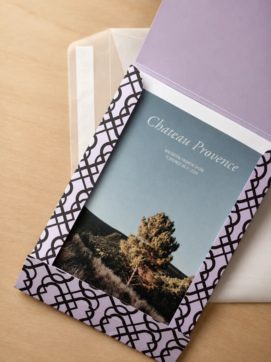 Fold-out Baldessarini Château Provence invitation in a transparent sleeve