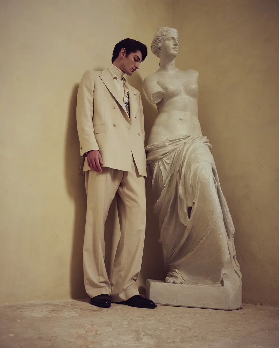 Baldessarini model beside a sculpture at Château Provence